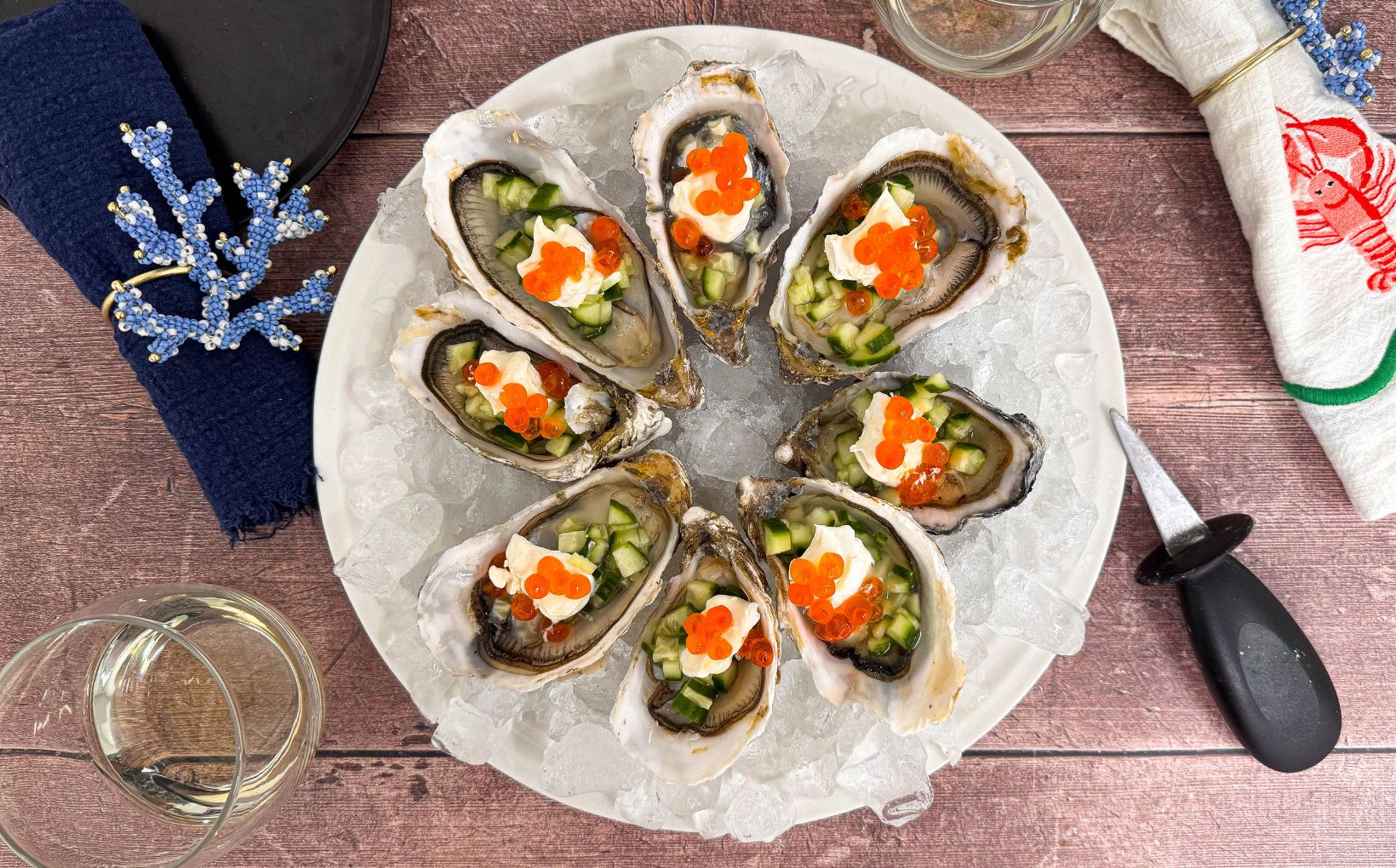 Oysters with Salmon Caviar and Creme Fraiche