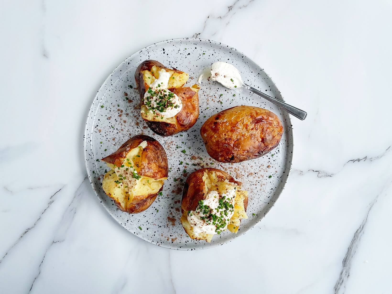 Baked Potatoes with Sour Cream, Chives and Truffle Dust