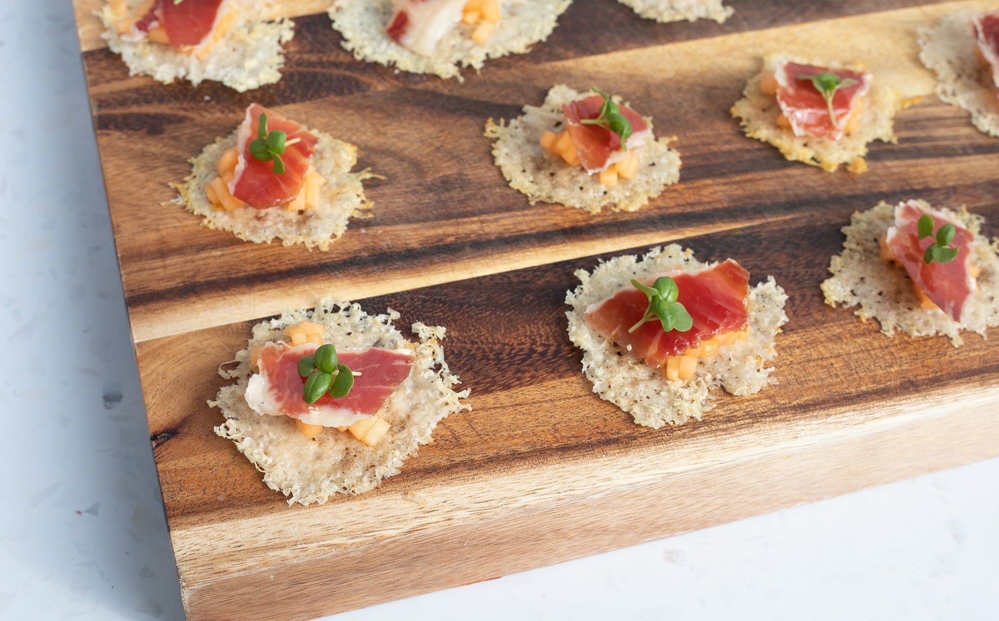 Parmesan Tweel Canapes with Iberico Bellota Ham and Melon