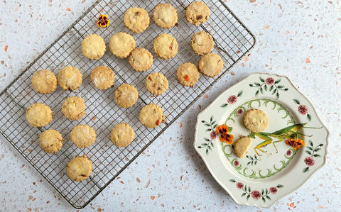 Tagette flower shortbread biscuits decorated with vibrant edible flowers