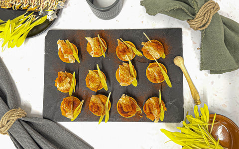 Bright orange tartlets filled with butternut squash and lobster tail