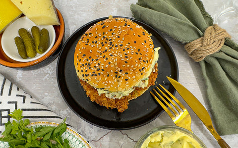 Crispy cod cheeks inside a sesame brioche bun with tartare sauce