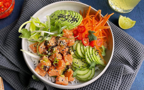 Spicy salmon poke bowl with sashimi-grade salmon and avocado