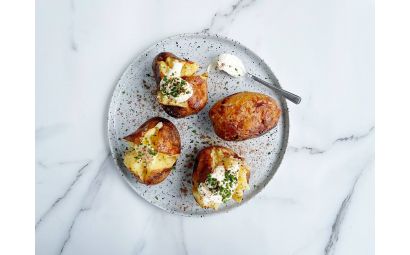 Baked Potatoes with Sour Cream, Chives and Truffle Dust 