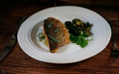 Pan Fried Sea Bass with Crushed Jersey Royals and Minted Courgettes